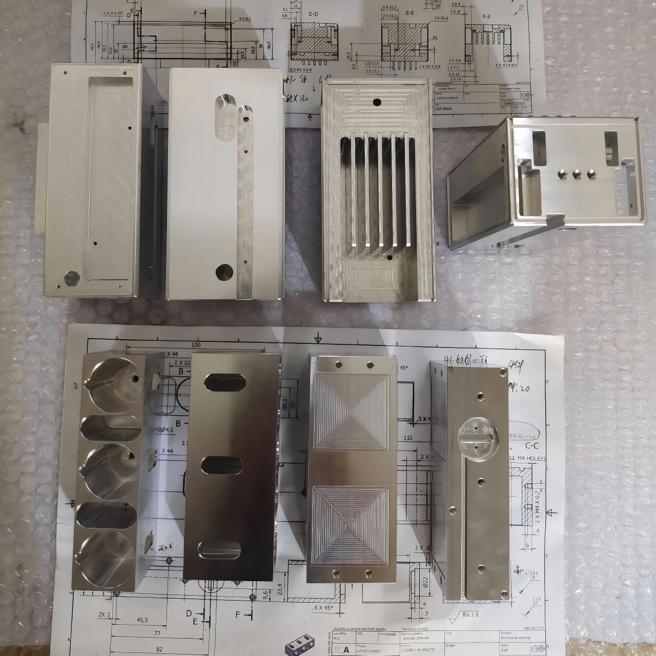 Precision CNC machined aluminum parts with polished surface, holes, slots, and complex milled cavities